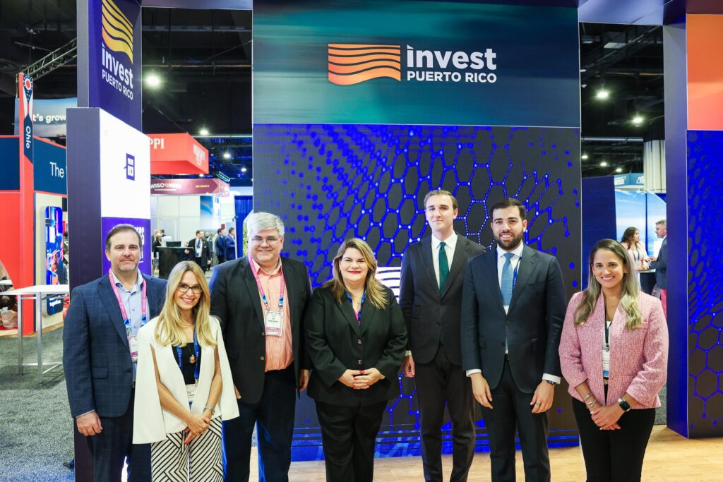 From left to right: Charlie Maddox, COO of Dot AI; Ella Woger-Nieves, CEO of Invest Puerto Rico; Ed Nabrotzky, CEO of Dot AI; Puerto Rico Governor Jenniffer González Colón; Trevor Kellogg, Chief of Staff of the International Trade Administration; Sebastián Negrón, Secretary of the Puerto Rico Department of Economic Development and Commerce; and Gabriella Boffelli, Executive Director of the Puerto Rico Federal Affairs Administration.